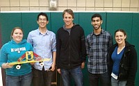 Students and Tony Hawk with robot skateboard
